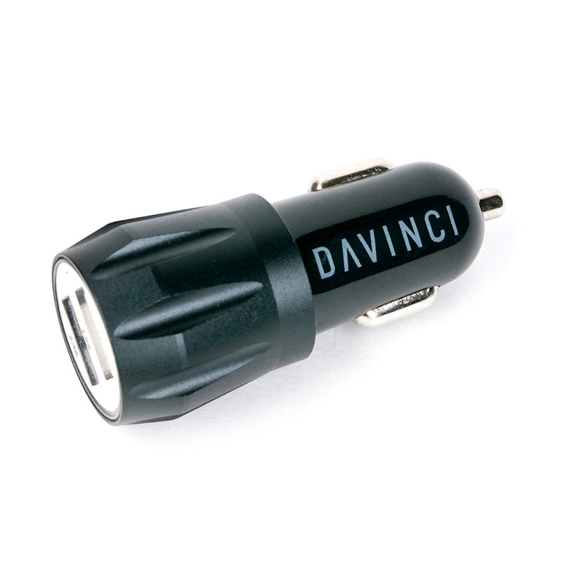 DaVinci IQ car charger plugged into a vehicle's 12V port for fast vaporizer charging