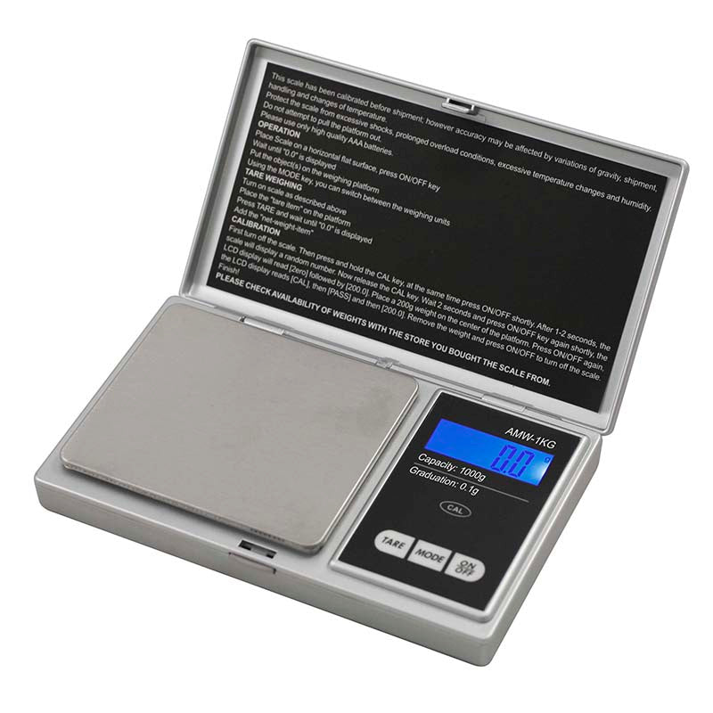 Digital pocket scale showing measurement on a jewelry table