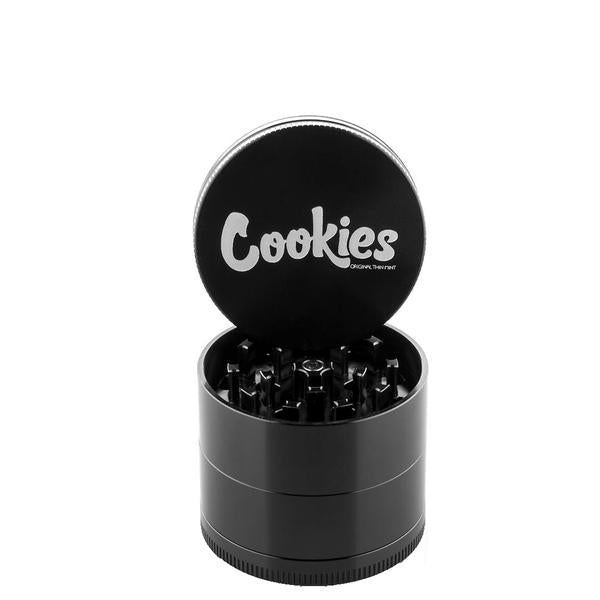 Santa Cruz Shredder 4-piece grinder showcasing the Cookies logo, highlighting its durable design.