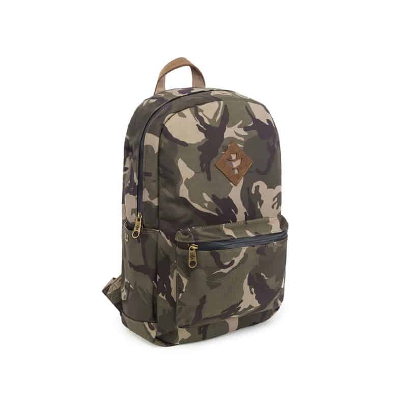 Outdoor traveler using Revelry Escort waterproof backpack in rainy conditions