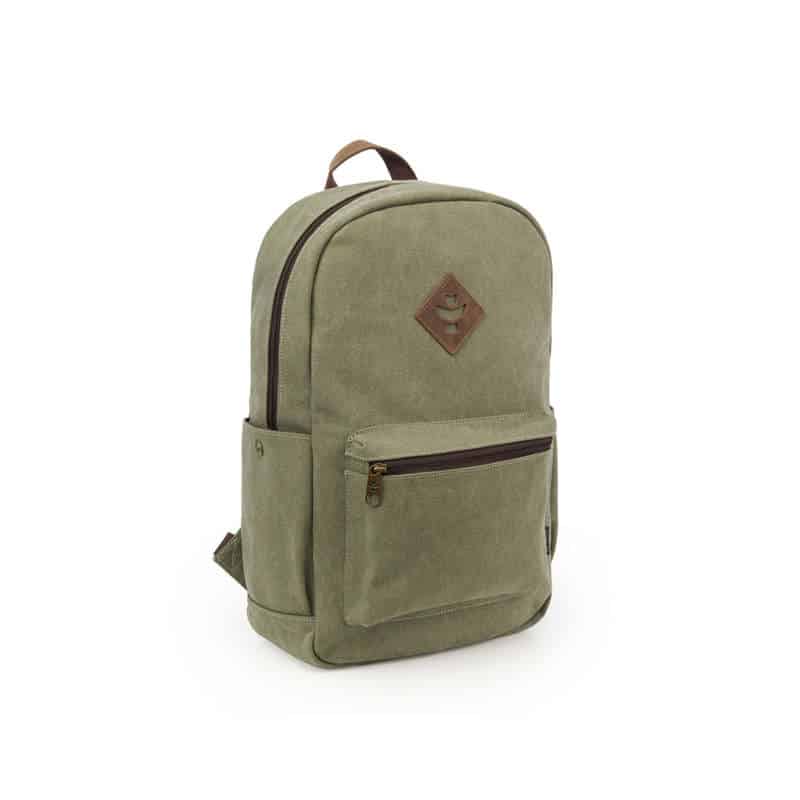 Outdoor traveler using Revelry Escort waterproof backpack in rainy conditions